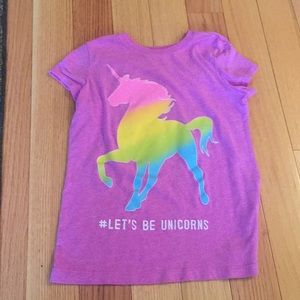 a purple unicorn shirt
